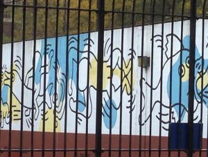 Keith Haring’s 170 foot long mural in Greenwich Village on a wall that connected the Carmine Street Pool to the James J. Walker Park handball court was painted in August 1987 and still stands today.